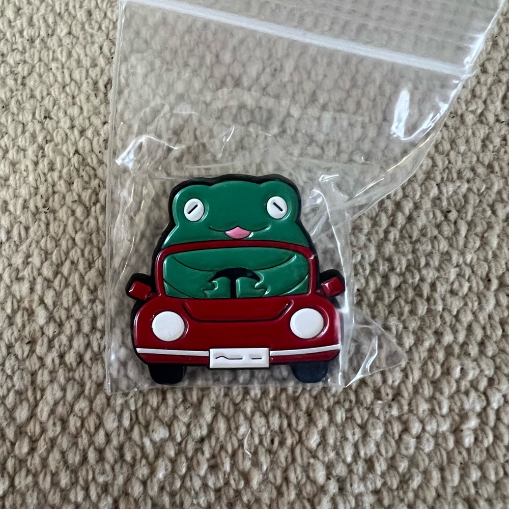 Frog Driving Car Enamel Pin